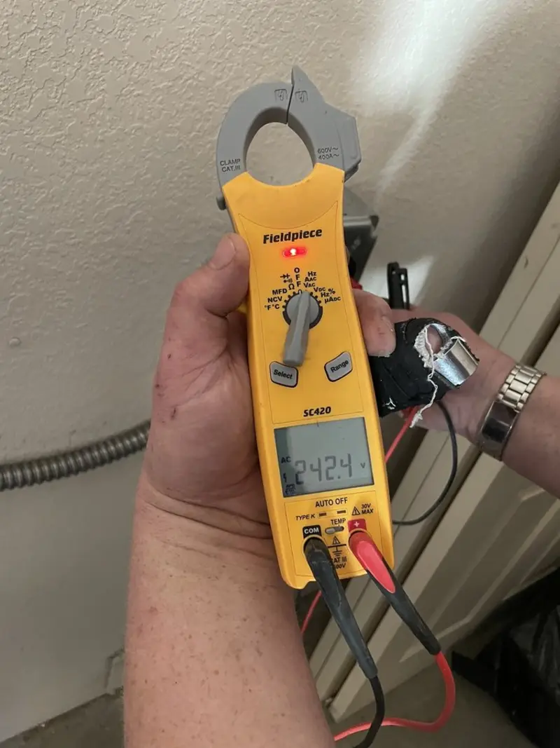 Voltage testing with clamp meter during Recessed Lighting Installation in Moreland Hills
